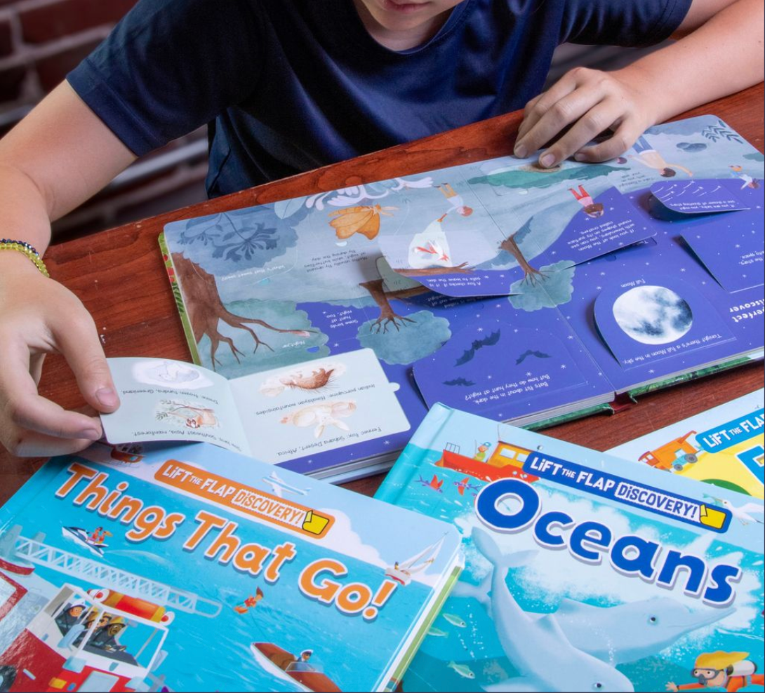 A child lifting a flap in a Lift the Flap book