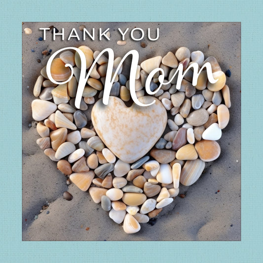 Thank You Mom” gift book showing a heart made of beach pebbles on sand with a teal cloth-wrapped border.